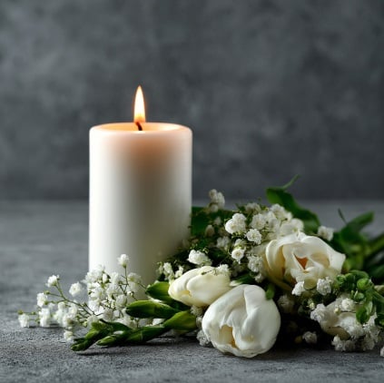 Memorial candle and white flowers for funeral homes in Eastampton Township, NJ.